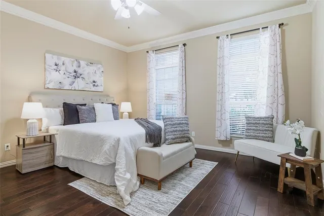 a spacious bedroom with a bed and a couch