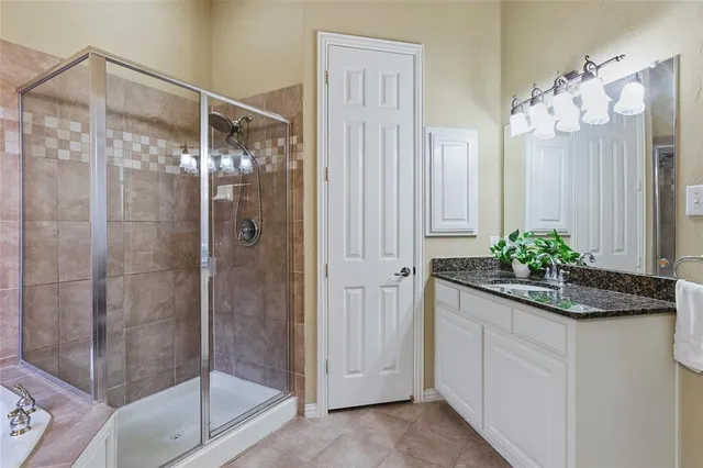 a bathroom with a shower and a sink