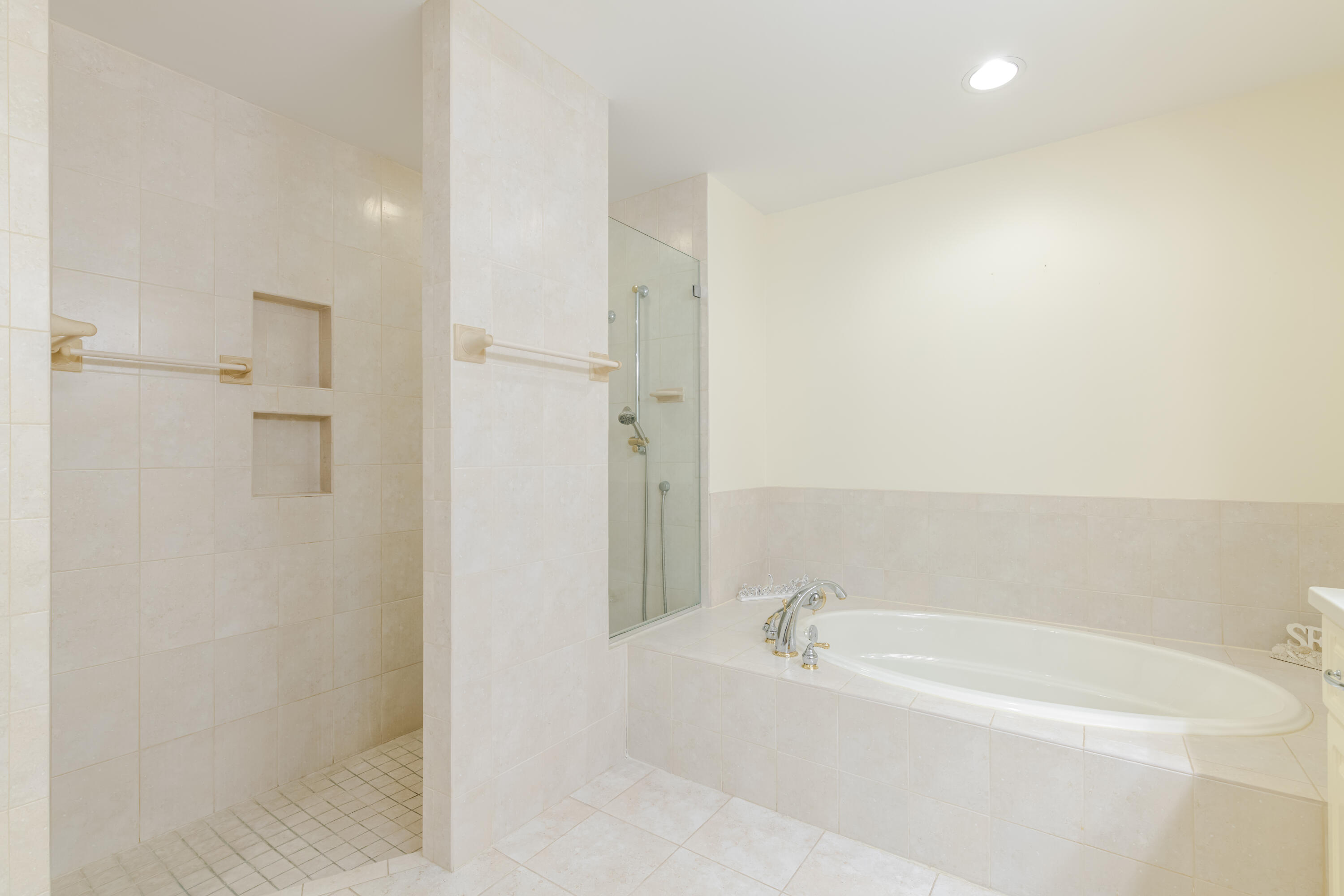 114 Beach Summit Court Jupiter, FL 33477 - Photo 48 of 97 a bathroom with a bathtub and shower