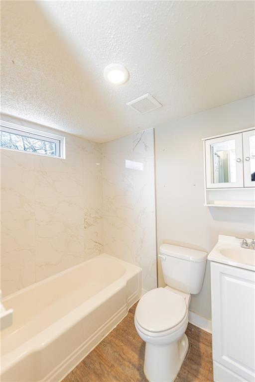 6197 Union Grove Road Lithia Springs, GA 30122 - Photo 13 of 24 a bathroom with a toilet and a shower