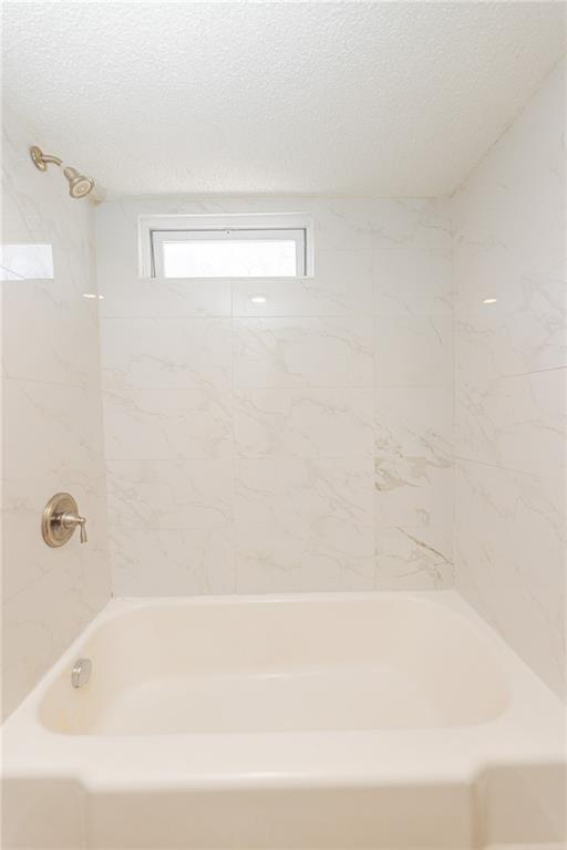 6197 Union Grove Road Lithia Springs, GA 30122 - Photo 14 of 24 a bathroom with a bathtub