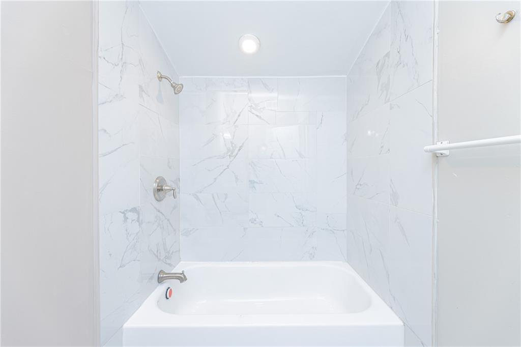 6197 Union Grove Road Lithia Springs, GA 30122 - Photo 18 of 24 a bathroom with a bathtub