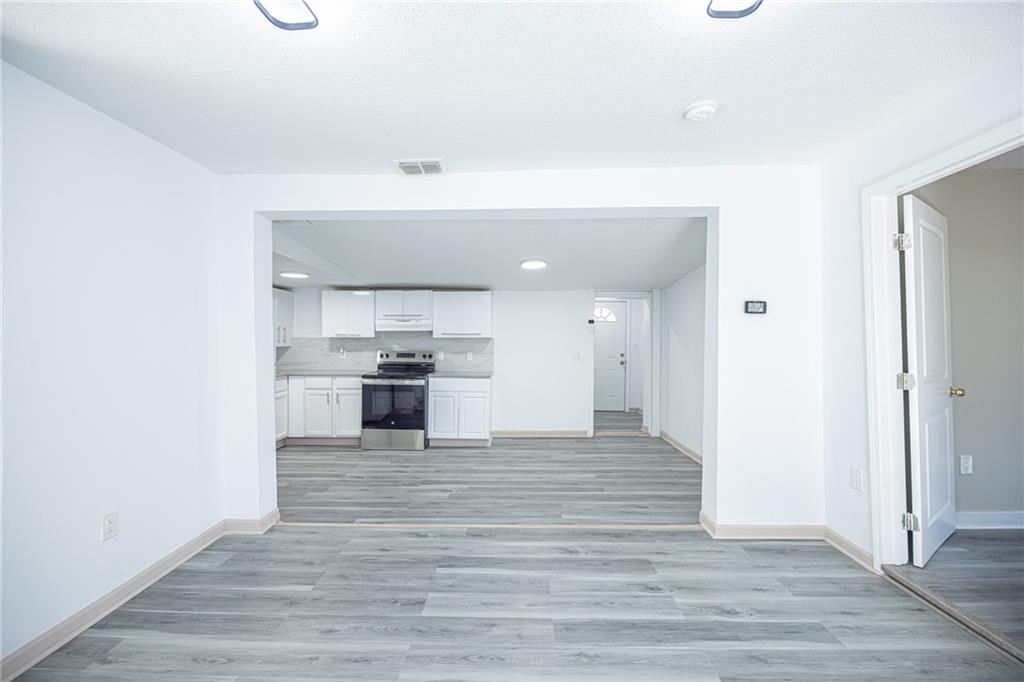 6197 Union Grove Road Lithia Springs, GA 30122 - Photo 3 of 24 a view of a kitchen with a sink and a stove top oven