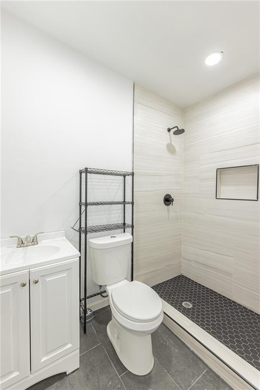 6197 Union Grove Road Lithia Springs, GA 30122 - Photo 7 of 24 a bathroom with a toilet a sink and shower