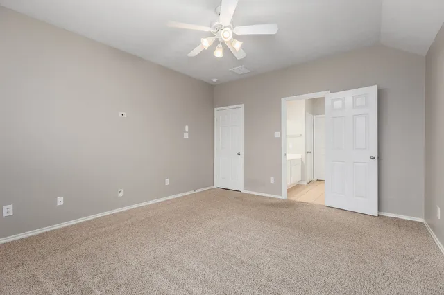 a bathroom with a tub 2 sink and mirror