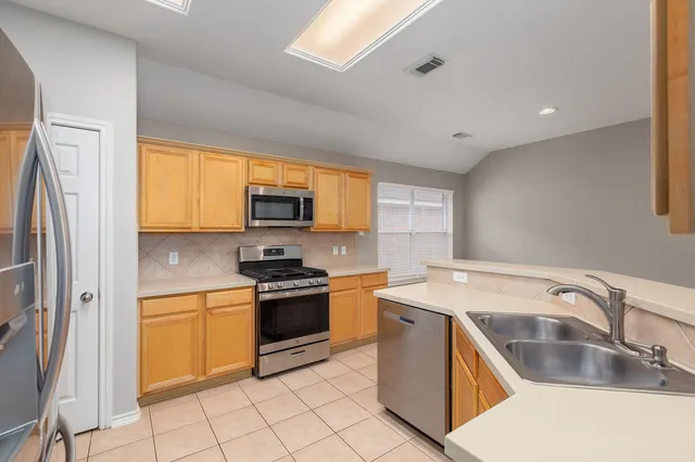 a bathroom with a sink a vanity and a mirror