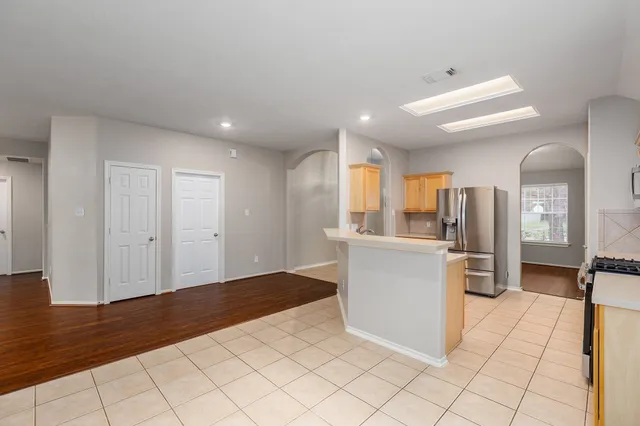 a view of a kitchen with a sink and a window