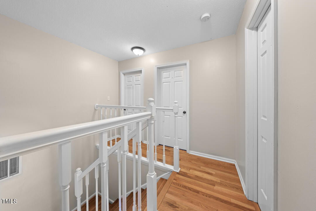 122 Stedwick Place Durham, NC 27712 - Photo 20 of 35 a view of a bedroom with wooden floor
