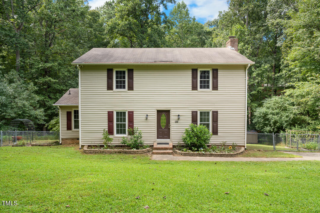122 Stedwick Place Durham, NC 27712 - Photo 2 of 35 a front view of a house with a yard
