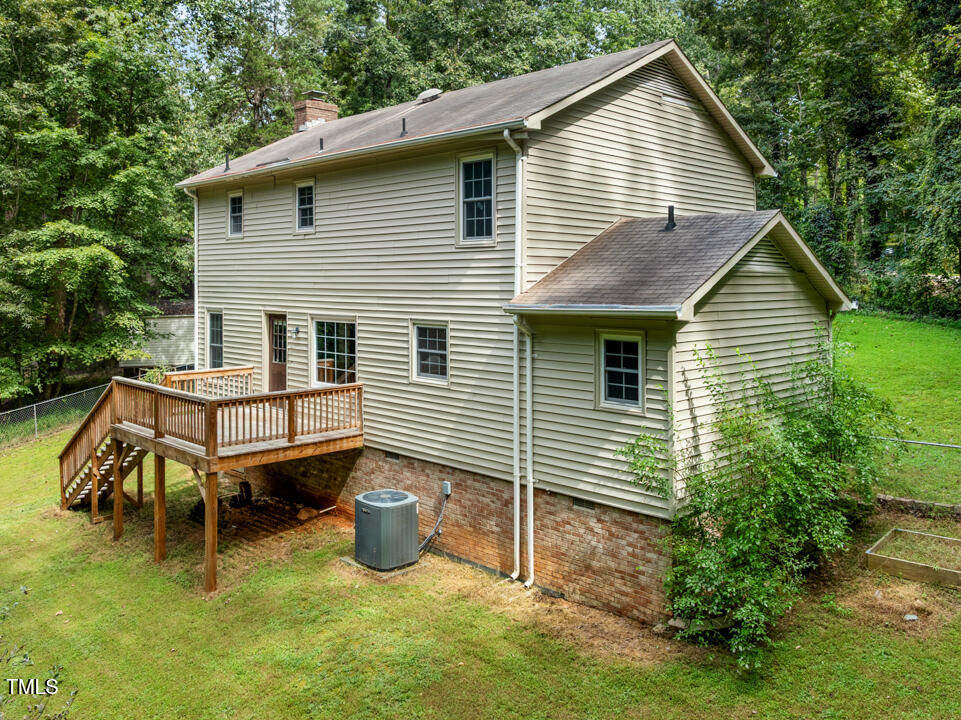 122 Stedwick Place Durham, NC 27712 - Photo 27 of 35 a view of a house with a yard and wooden fence