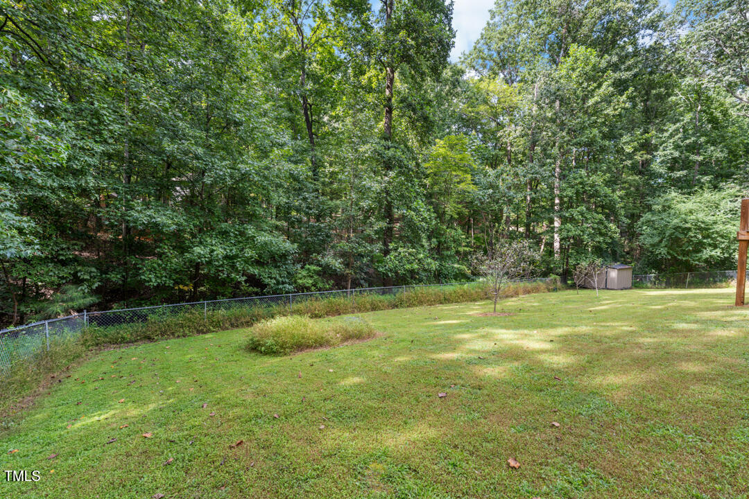 122 Stedwick Place Durham, NC 27712 - Photo 31 of 35 a view of field with trees in the background