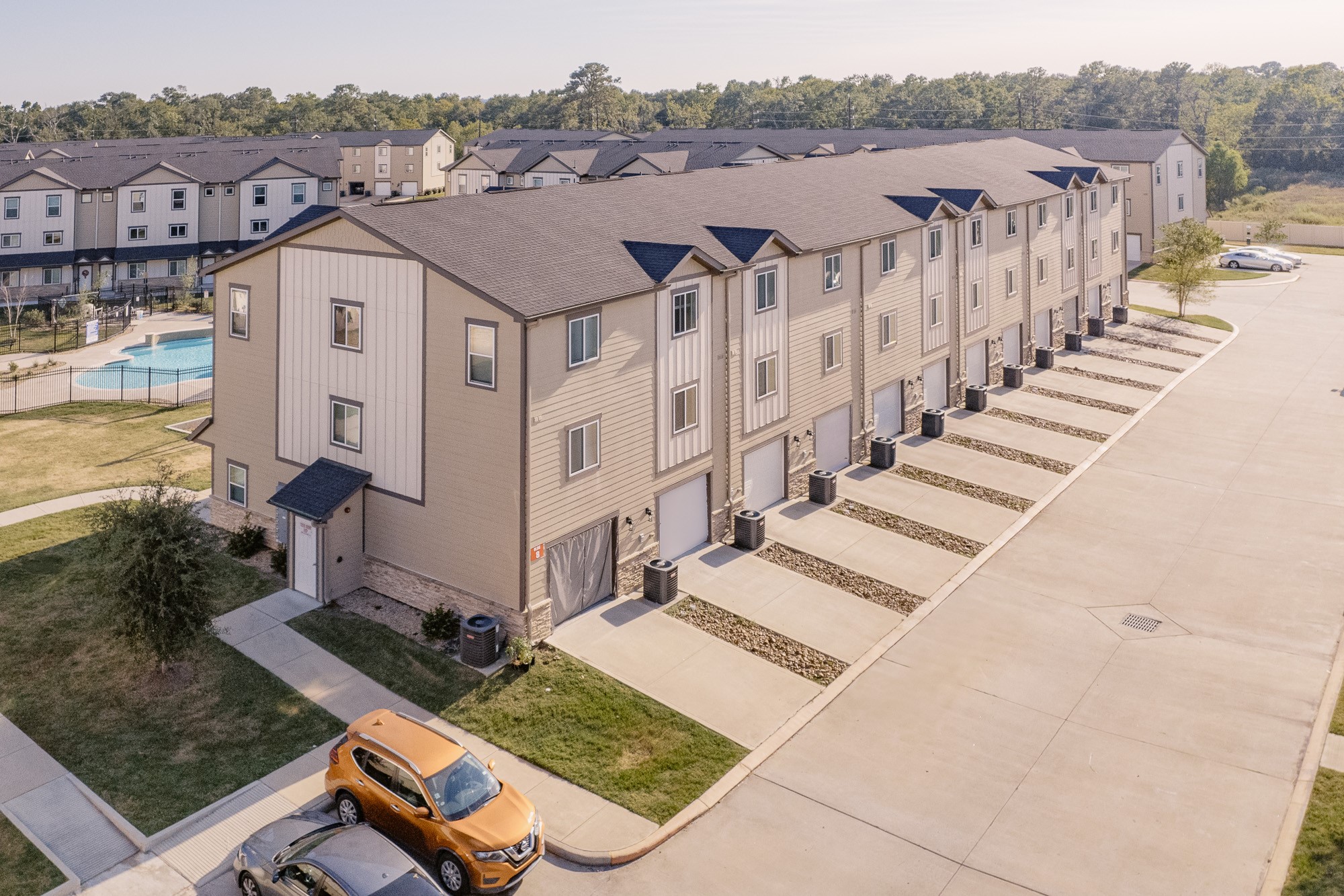 12603 Telge Road, Unit 28E Cypress, TX 77429 - Photo 26 of 32 a view of a white house with a yard