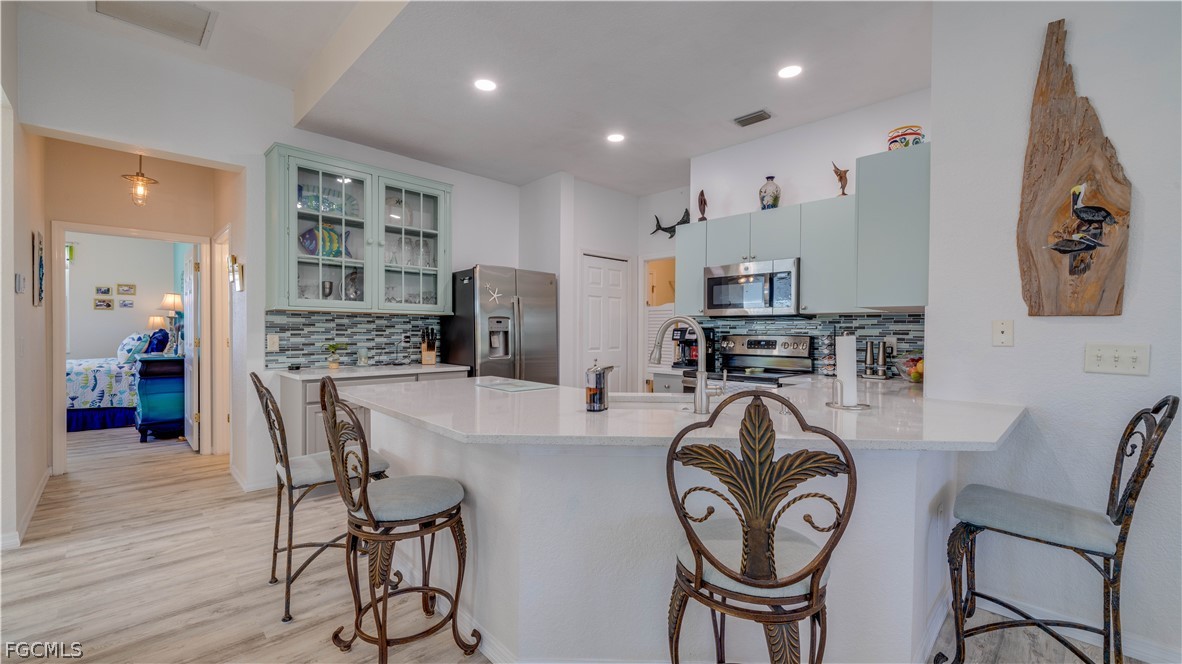 3181 Matecumbe Key Road, Unit 4 Punta Gorda, FL 33955 - Photo 11 of 50 a view of kitchen and dining area with furniture