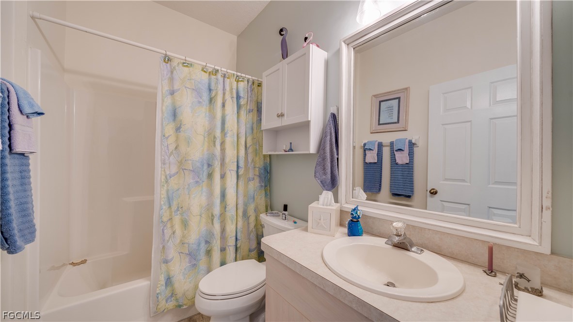 3181 Matecumbe Key Road, Unit 4 Punta Gorda, FL 33955 - Photo 21 of 50 a bathroom with a sink toilet and shower