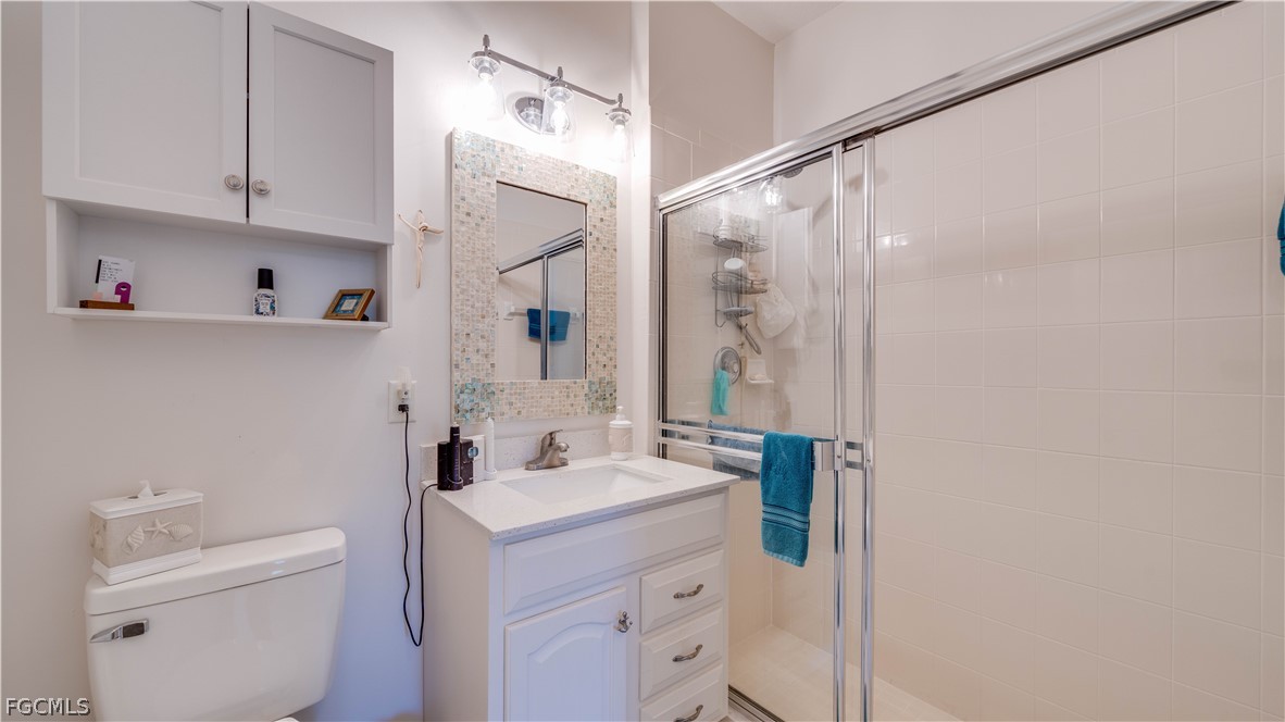 3181 Matecumbe Key Road, Unit 4 Punta Gorda, FL 33955 - Photo 26 of 50 a bathroom with a sink a toilet and shower