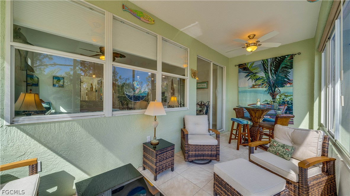 3181 Matecumbe Key Road, Unit 4 Punta Gorda, FL 33955 - Photo 28 of 50 a living room with furniture and a large window