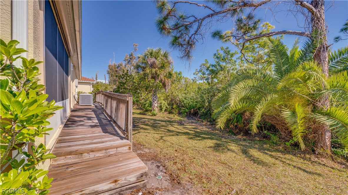 3181 Matecumbe Key Road, Unit 4 Punta Gorda, FL 33955 - Photo 29 of 50 a view of a backyard with plants