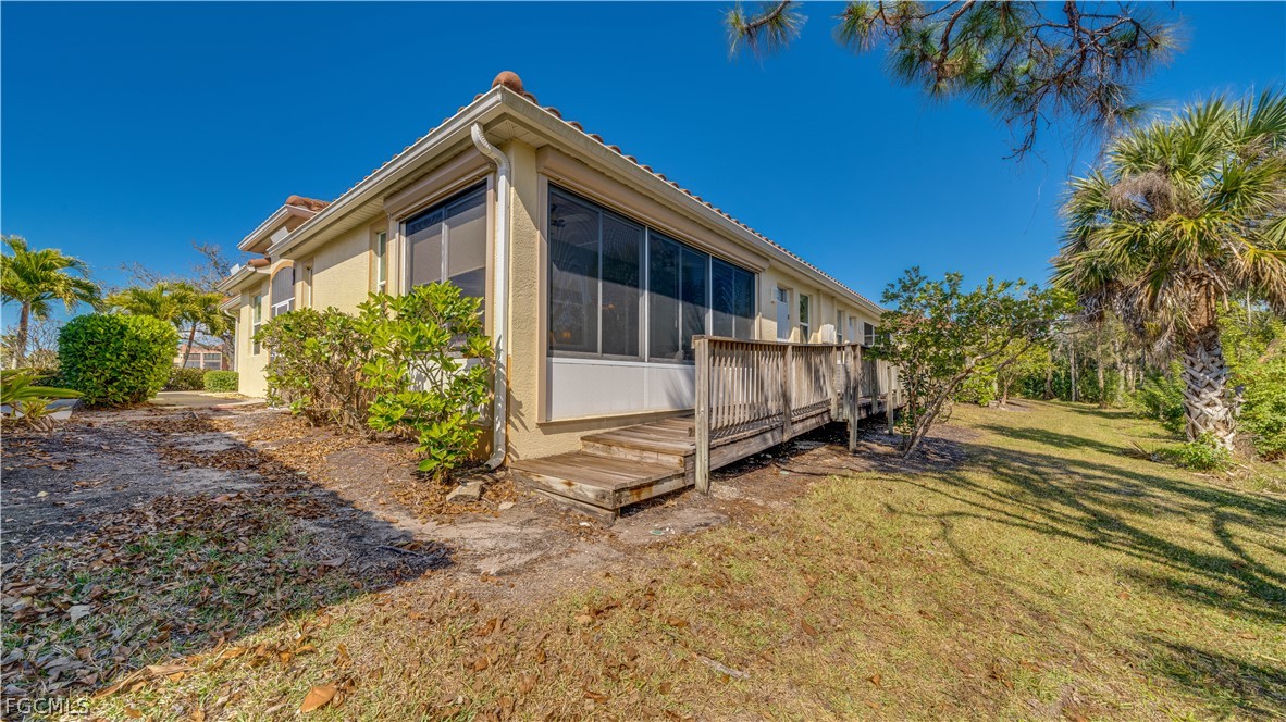 3181 Matecumbe Key Road, Unit 4 Punta Gorda, FL 33955 - Photo 30 of 50 a view of a house with a yard
