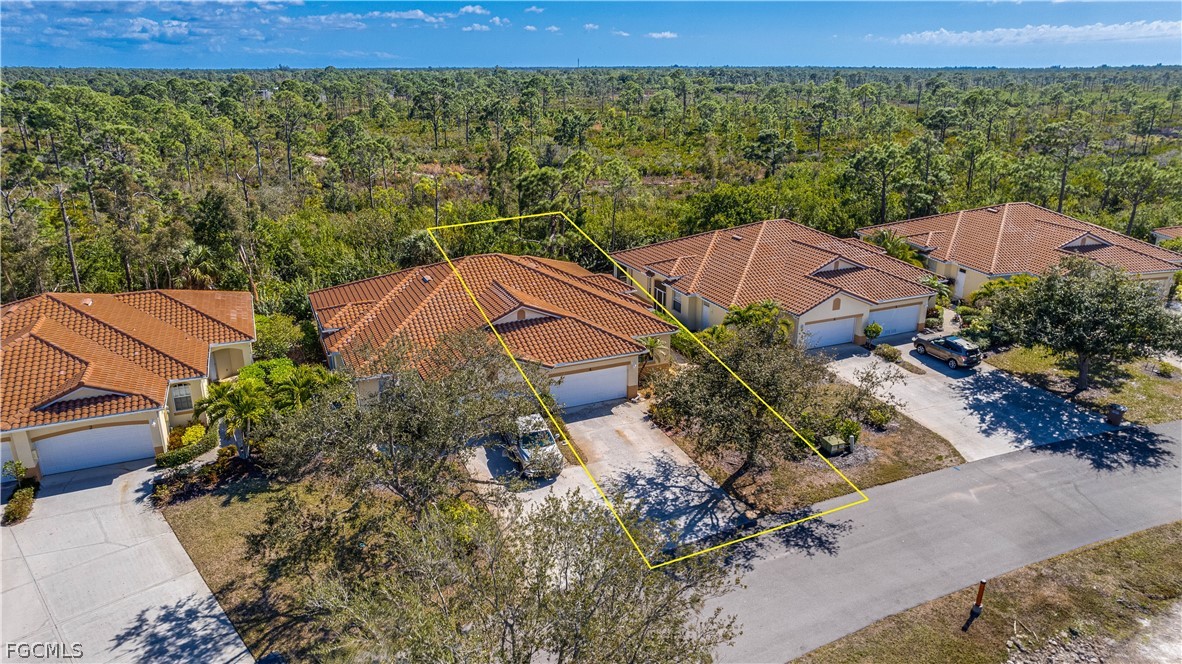 3181 Matecumbe Key Road, Unit 4 Punta Gorda, FL 33955 - Photo 33 of 50 an aerial view of a house with a yard