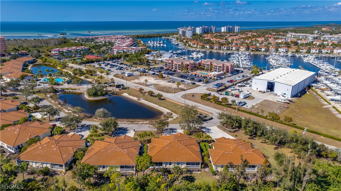 3181 Matecumbe Key Road, Unit 4 Punta Gorda, FL 33955 - Photo 37 of 50 an aerial view of residential building and parking space