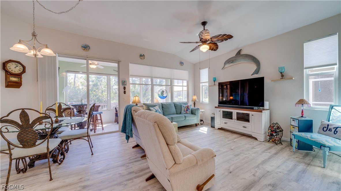 3181 Matecumbe Key Road, Unit 4 Punta Gorda, FL 33955 - Photo 5 of 50 a living room with furniture a flat screen tv and a window