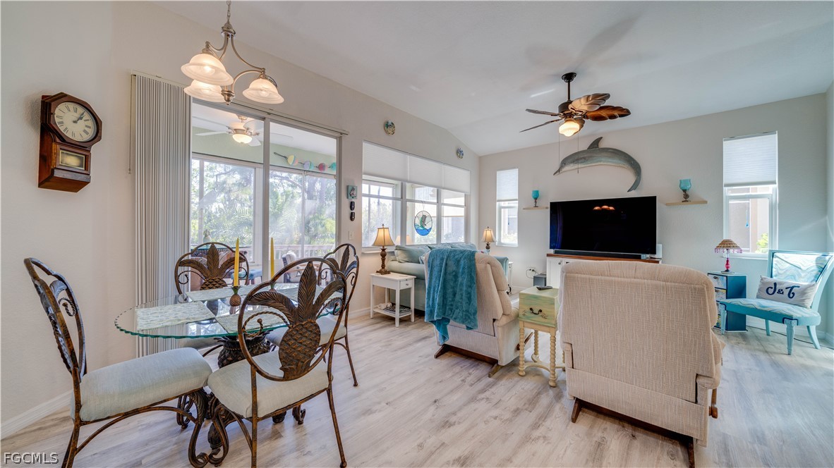 3181 Matecumbe Key Road, Unit 4 Punta Gorda, FL 33955 - Photo 7 of 50 a view of a dining room with furniture window and wooden floor