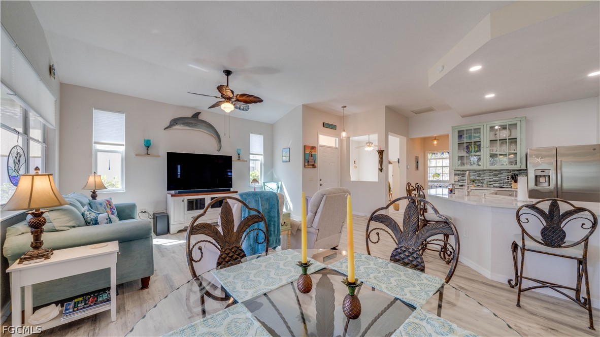 3181 Matecumbe Key Road, Unit 4 Punta Gorda, FL 33955 - Photo 9 of 50 a view of a livingroom with furniture and a flat screen tv