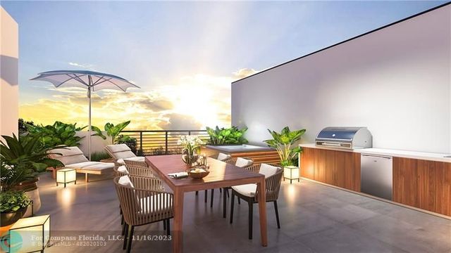 a dining room with furniture and a window