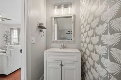 a bathroom with a sink and a mirror
