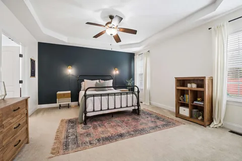 a bedroom with a bed and dresser