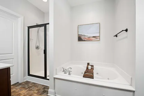 a bathroom with a bathtub and a sink