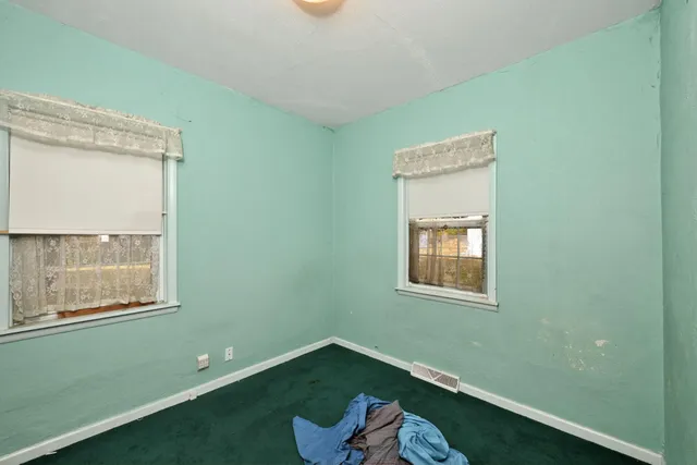 a view of a room that has a window in it