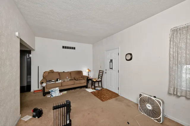 a living room with furniture and a couch