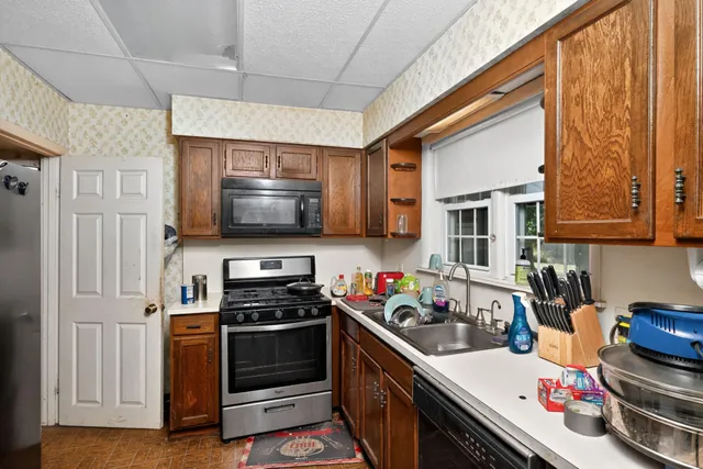 a kitchen with a stove and a microwave