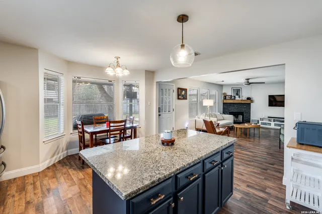 a kitchen island with granite countertop dining room