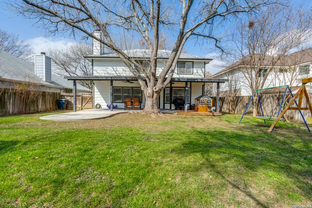 a view of a building with a yard