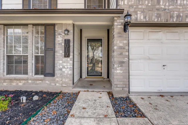 a view of a brick house with windows