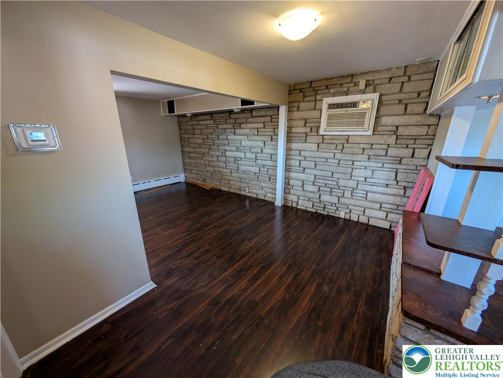 950 South 25th Street, Unit 1 Easton, PA 18042 - Photo 5 of 16 a view of an empty room with wooden floor and a window