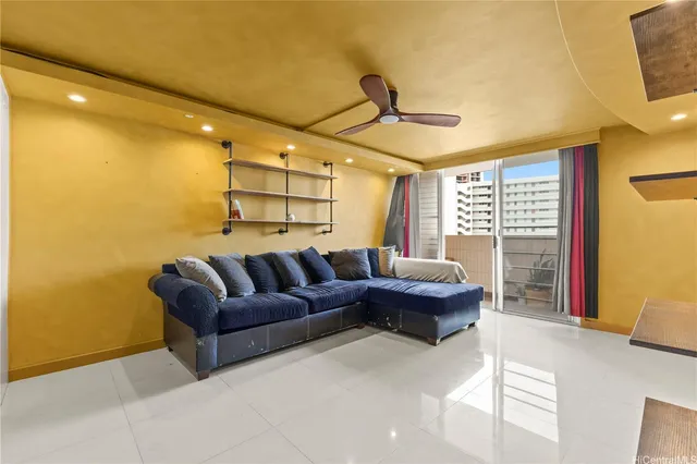 a living room with a couch and a window