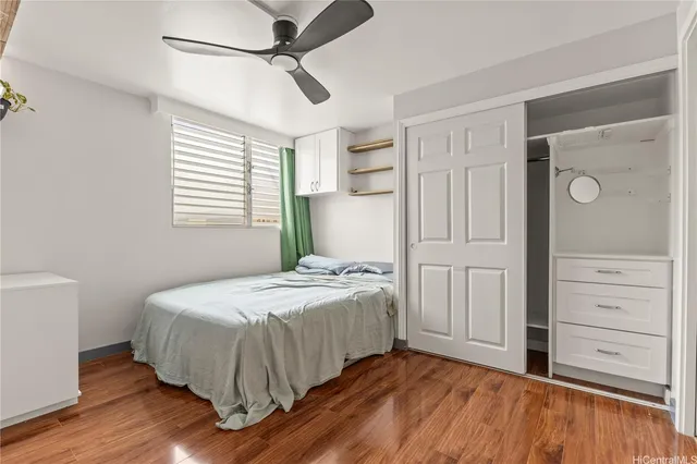 a bedroom with a bed and a dresser