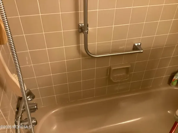 a bathroom with a bath tub