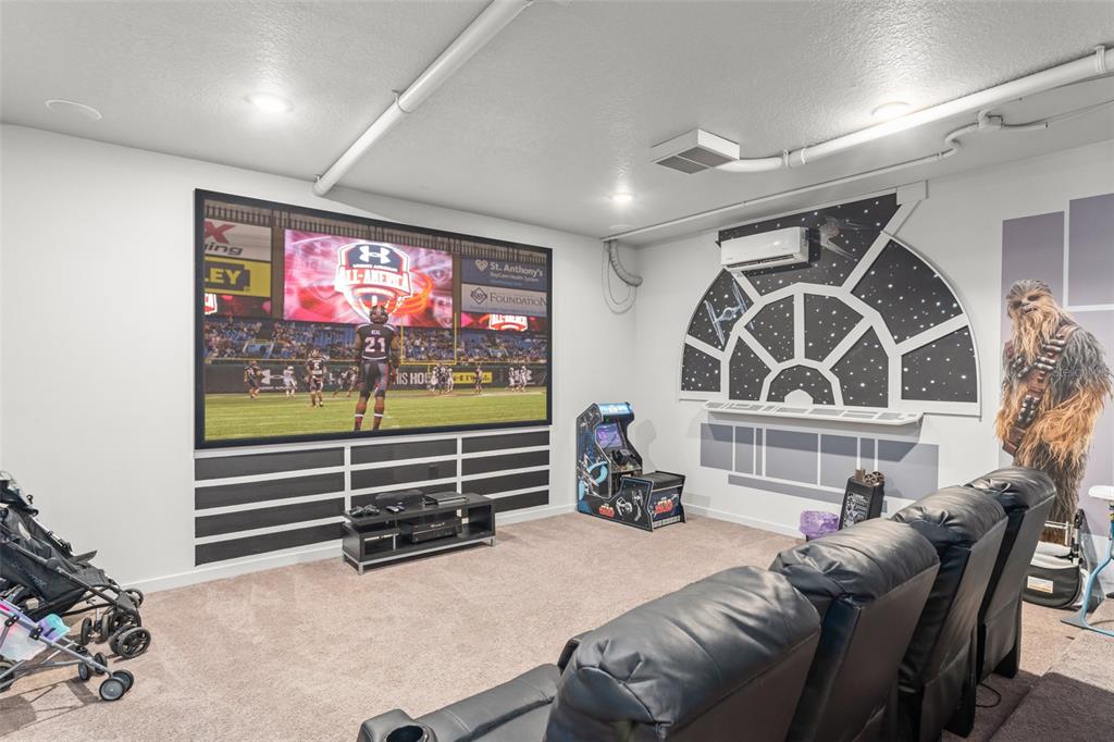 717 Desert Mountain Court Reunion, FL 34747 - Photo 12 of 62 a room with furniture and a flat screen tv