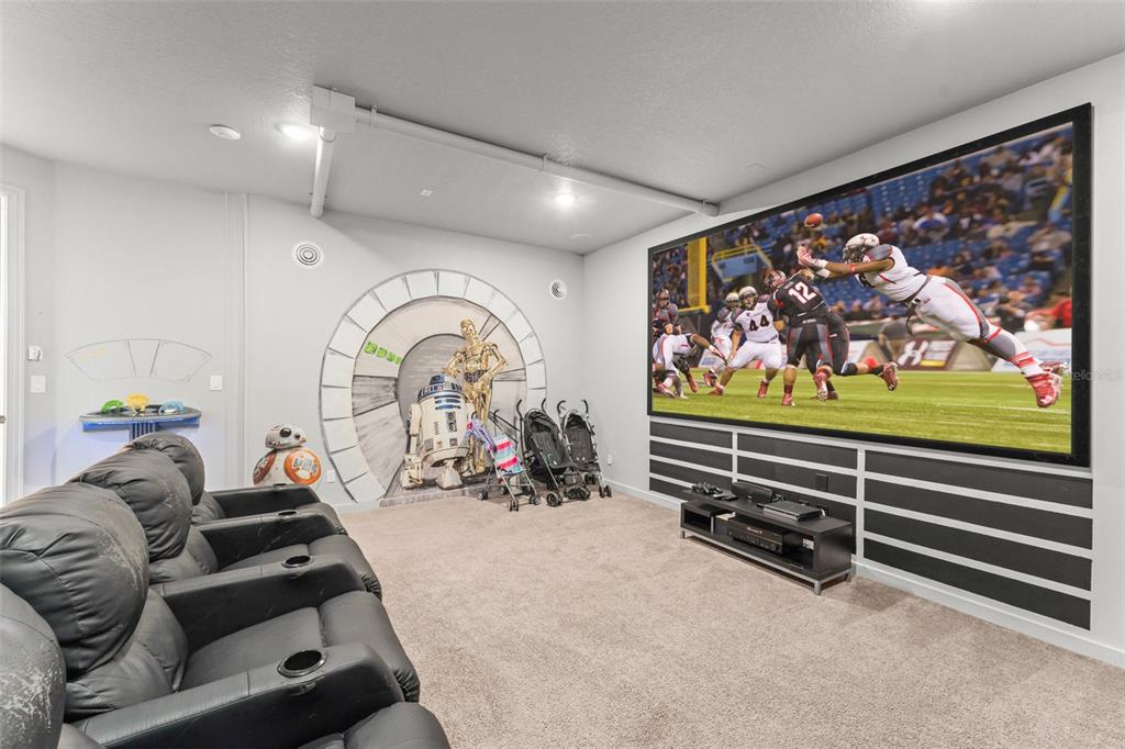 717 Desert Mountain Court Reunion, FL 34747 - Photo 13 of 62 a room with lots of gym equipment and a large window