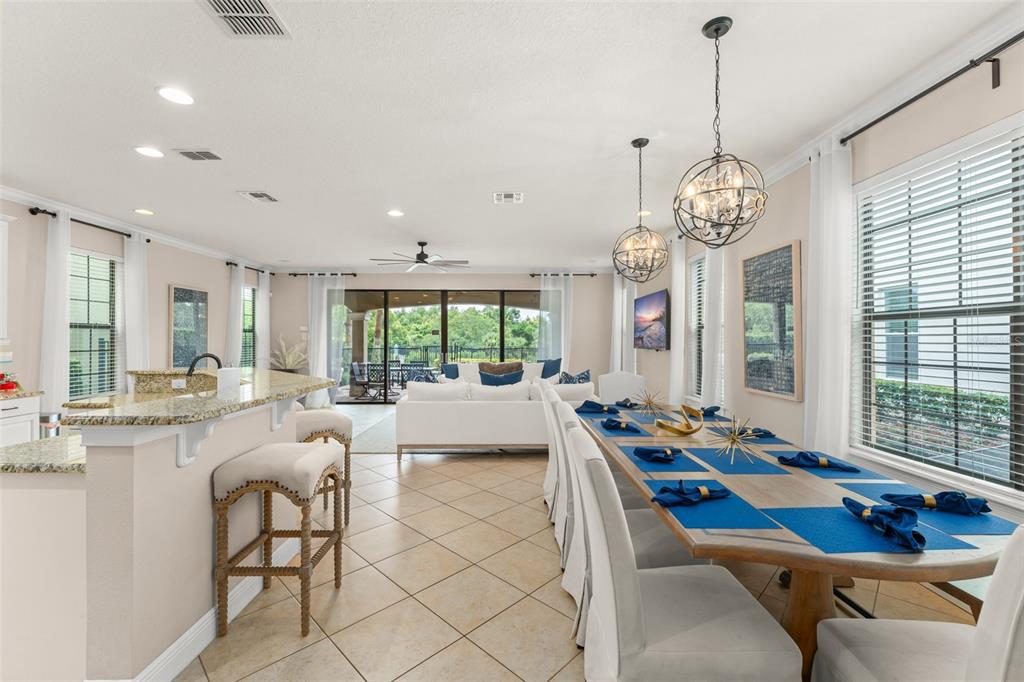 717 Desert Mountain Court Reunion, FL 34747 - Photo 19 of 62 a room with lots of white furniture and window
