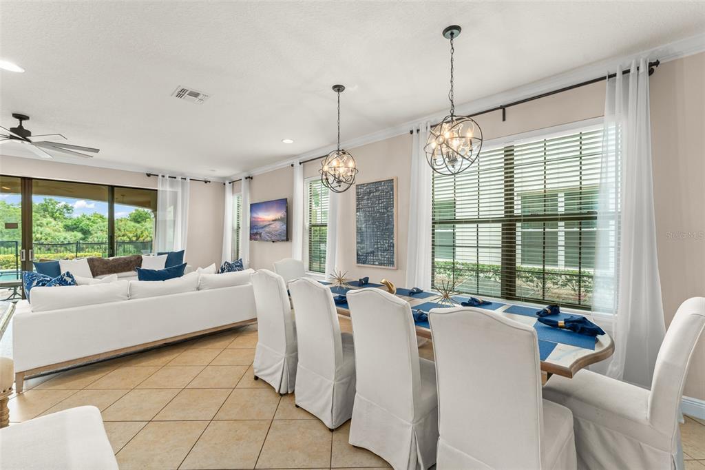 717 Desert Mountain Court Reunion, FL 34747 - Photo 20 of 62 a living room with furniture and large windows