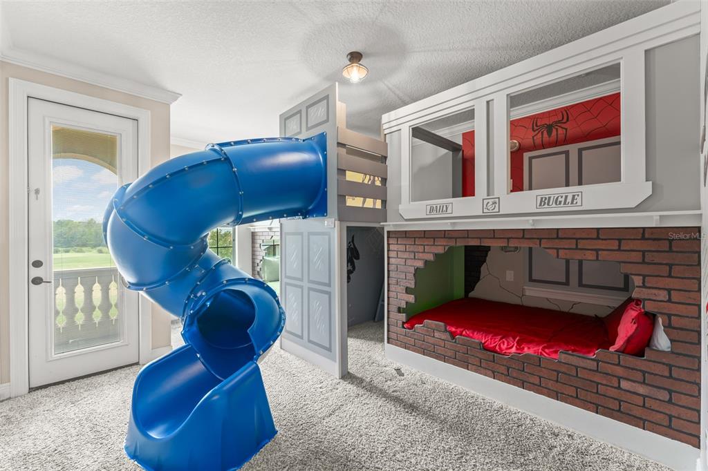 717 Desert Mountain Court Reunion, FL 34747 - Photo 40 of 62 a living room with furniture and a fireplace