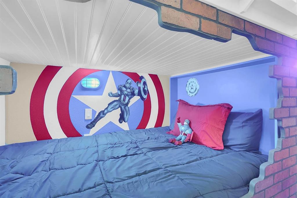 717 Desert Mountain Court Reunion, FL 34747 - Photo 43 of 62 a view of a bedroom with a bed