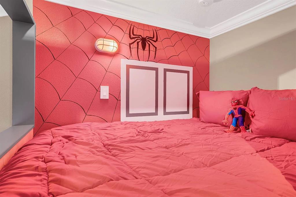 717 Desert Mountain Court Reunion, FL 34747 - Photo 44 of 62 a large bed with a large bed and a mirror