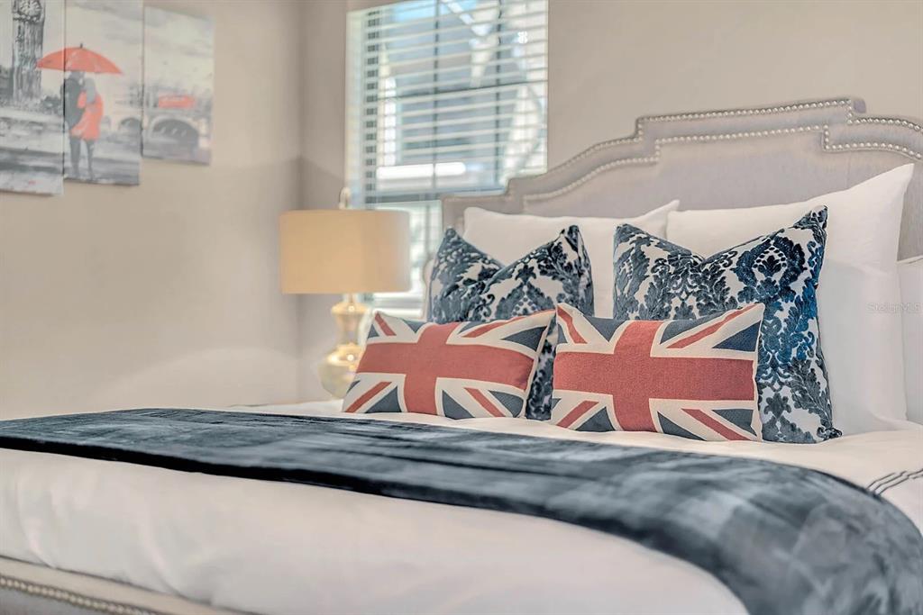 717 Desert Mountain Court Reunion, FL 34747 - Photo 48 of 62 a view of a bedroom with a bed and a window