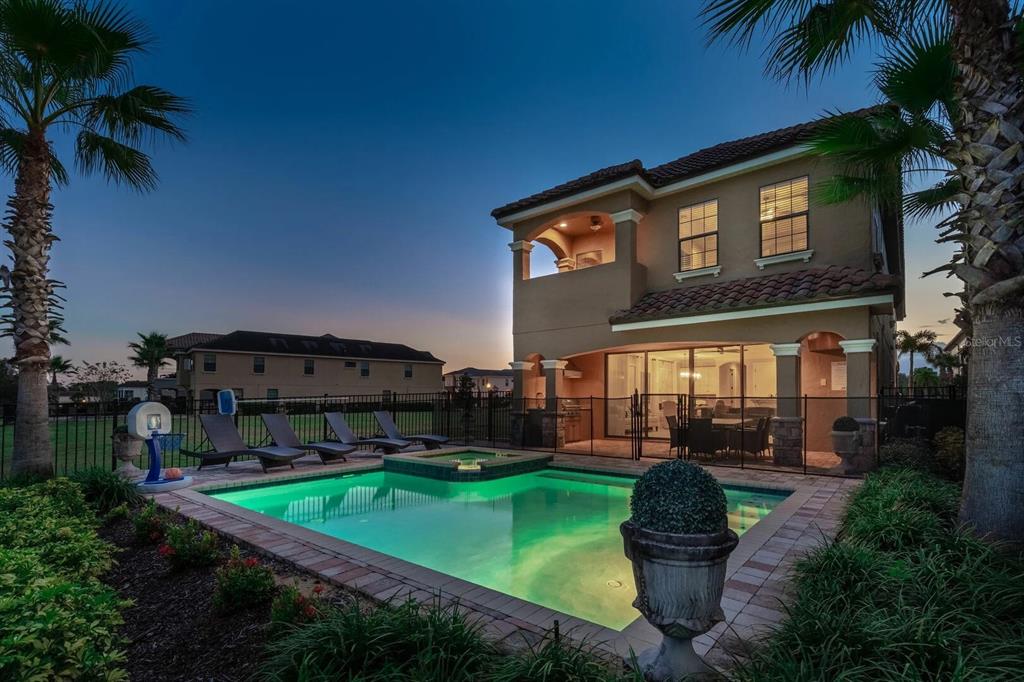 717 Desert Mountain Court Reunion, FL 34747 - Photo 54 of 62 a front view of a house with garden